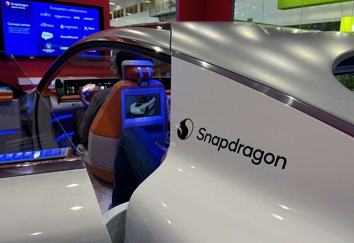 people in Qualcomm concept car at IAA MOBILITY