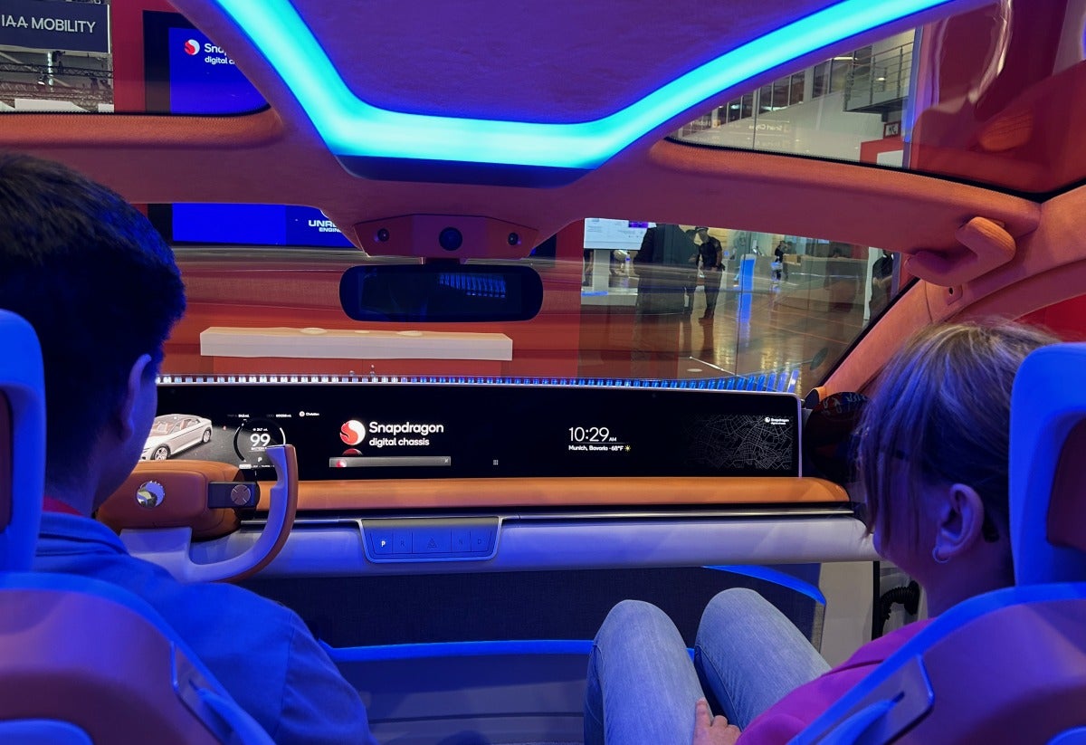 people in Qualcomm concept car at IAA MOBILITY